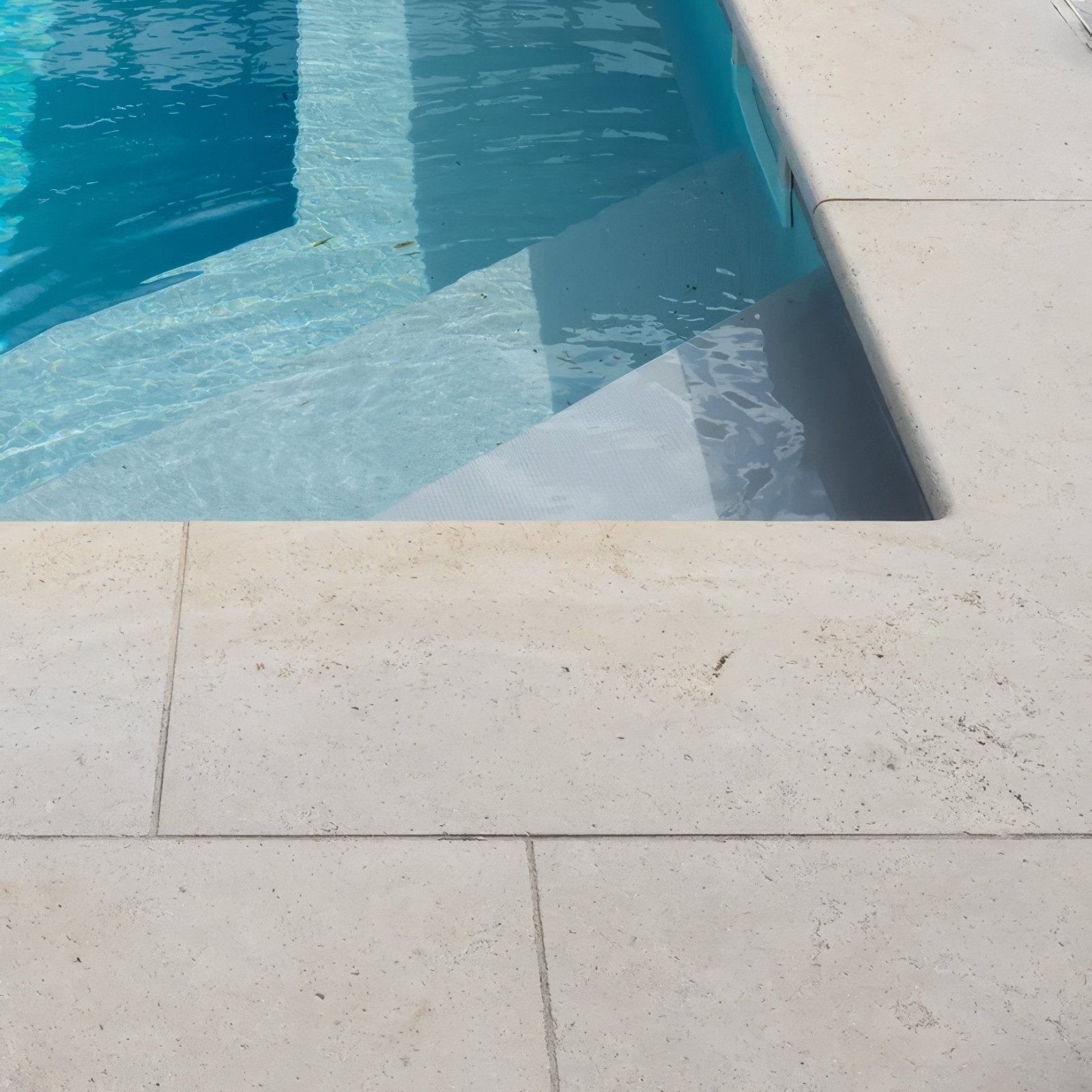 Beige wychwood limestone etched bullnose coping pool deck tiles with subtle natural veining