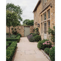 Wychwood Limestone Paving Tumbled & Etched laid in a courtyard