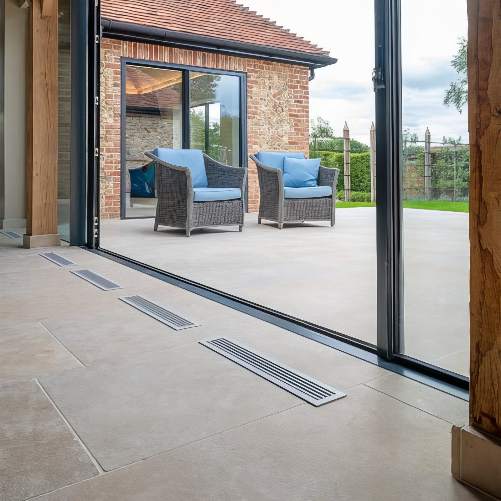 Silver metallic floor vents with sleek modern design for wychwood limestone tumbled and etched finish flooring