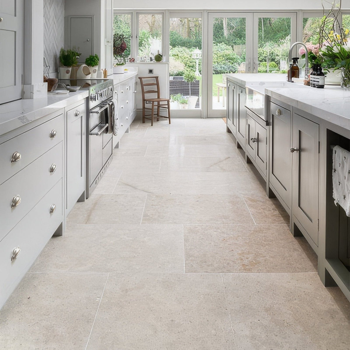 Beige wychwood limestone tumbled finish stone tile flooring with subtle natural veining in 60 x random sizes