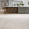 Beige wychwood limestone tumbled finish floor tiles with subtle natural veining in 60 x random sizes