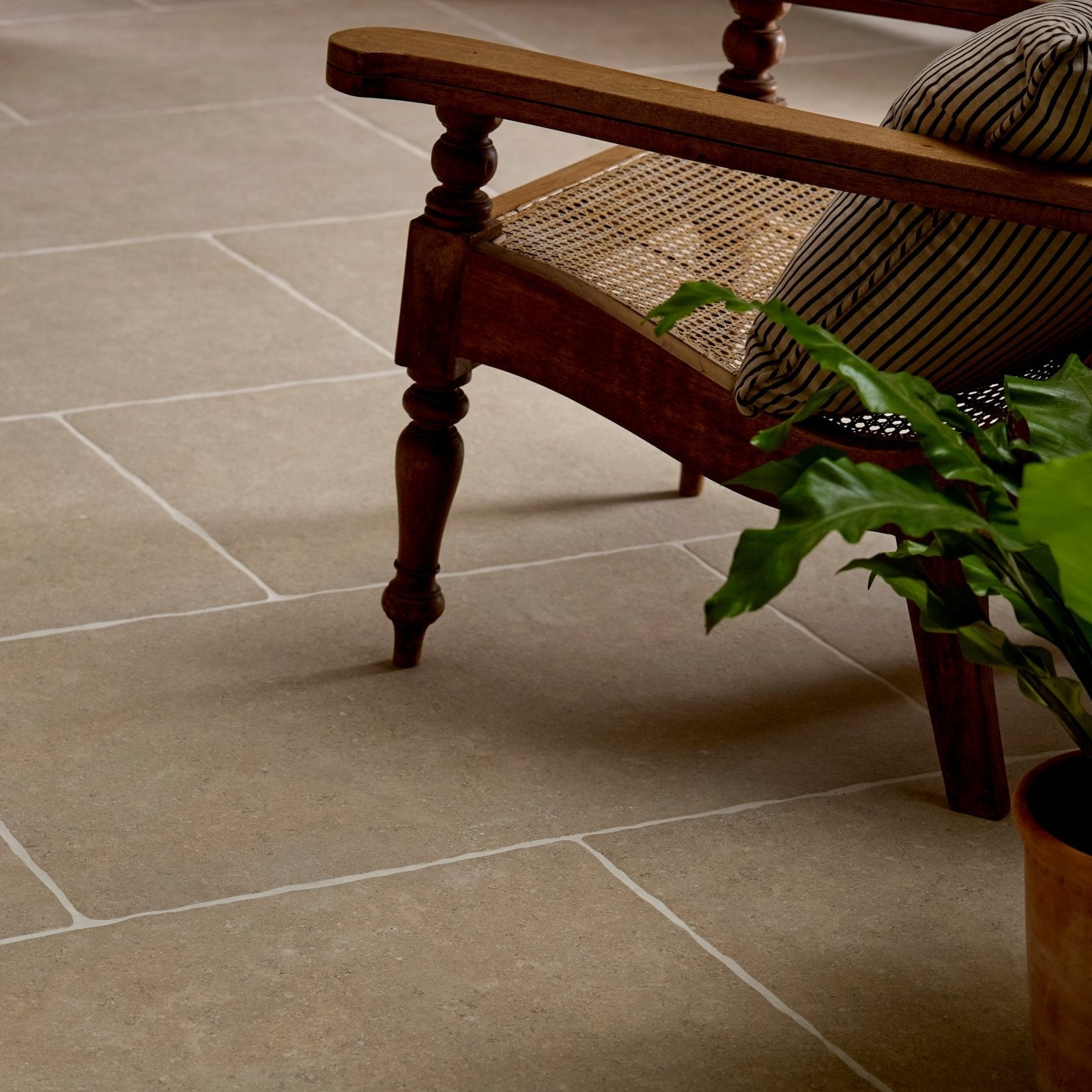 Wychwood Porcelain Matt 60 x 90cm beige stone-effect porcelain tiles with a rustic wooden chair