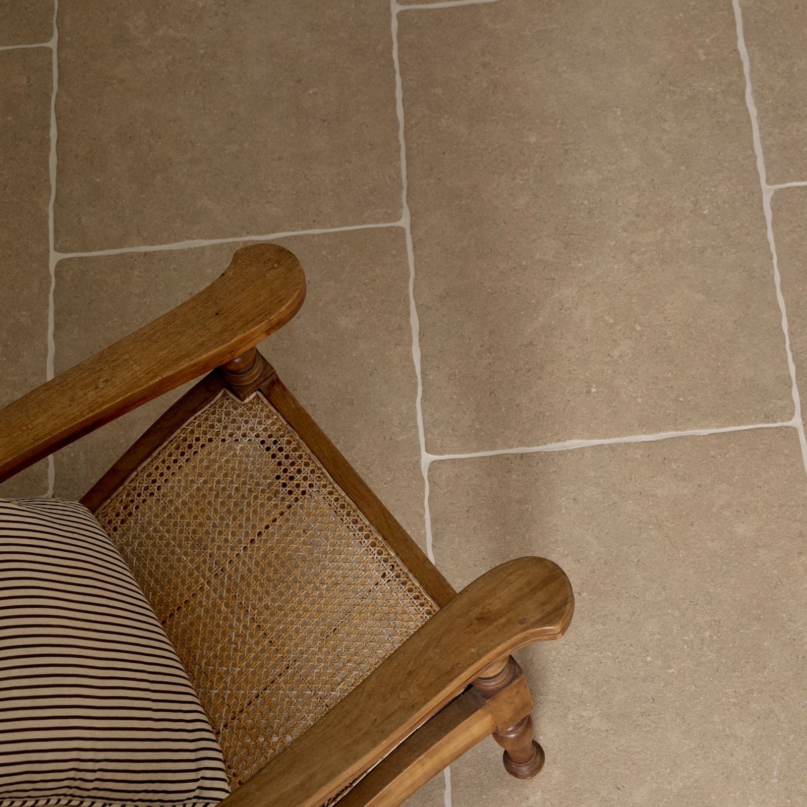Wychwood Porcelain Matt 60 x 90cm beige stone-effect porcelain tiles with a wooden chair