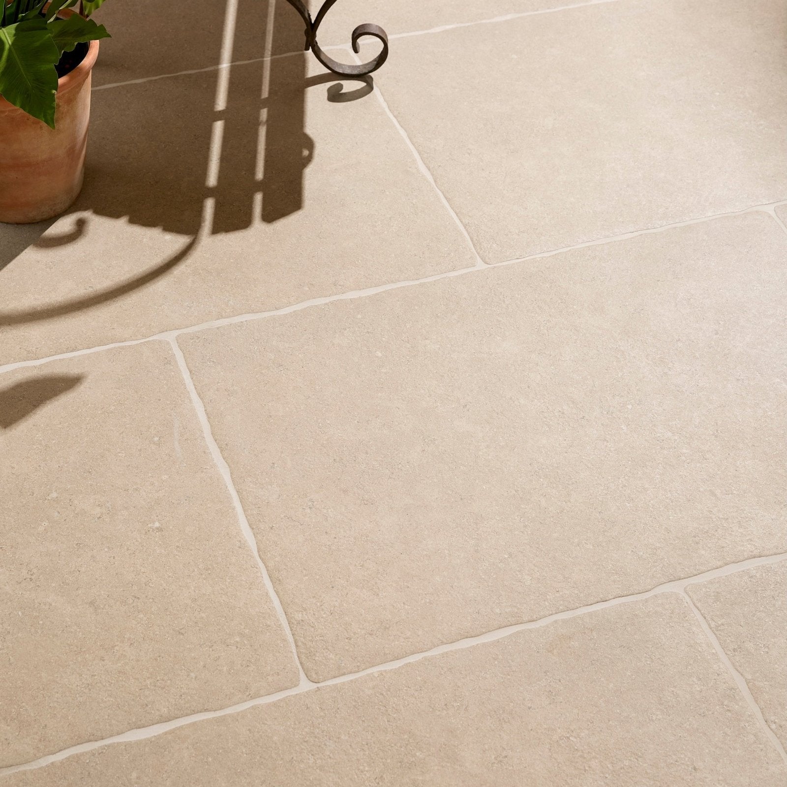 Beige wychwood porcelain paving tiles with subtle texture and natural veining for outdoor surfaces