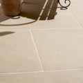 Beige wychwood porcelain paving textured stone tiles with subtle texture and white grout lines for outdoor use