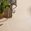 Beige wychwood porcelain paving textured stone tiles with subtle natural texture and light grout lines