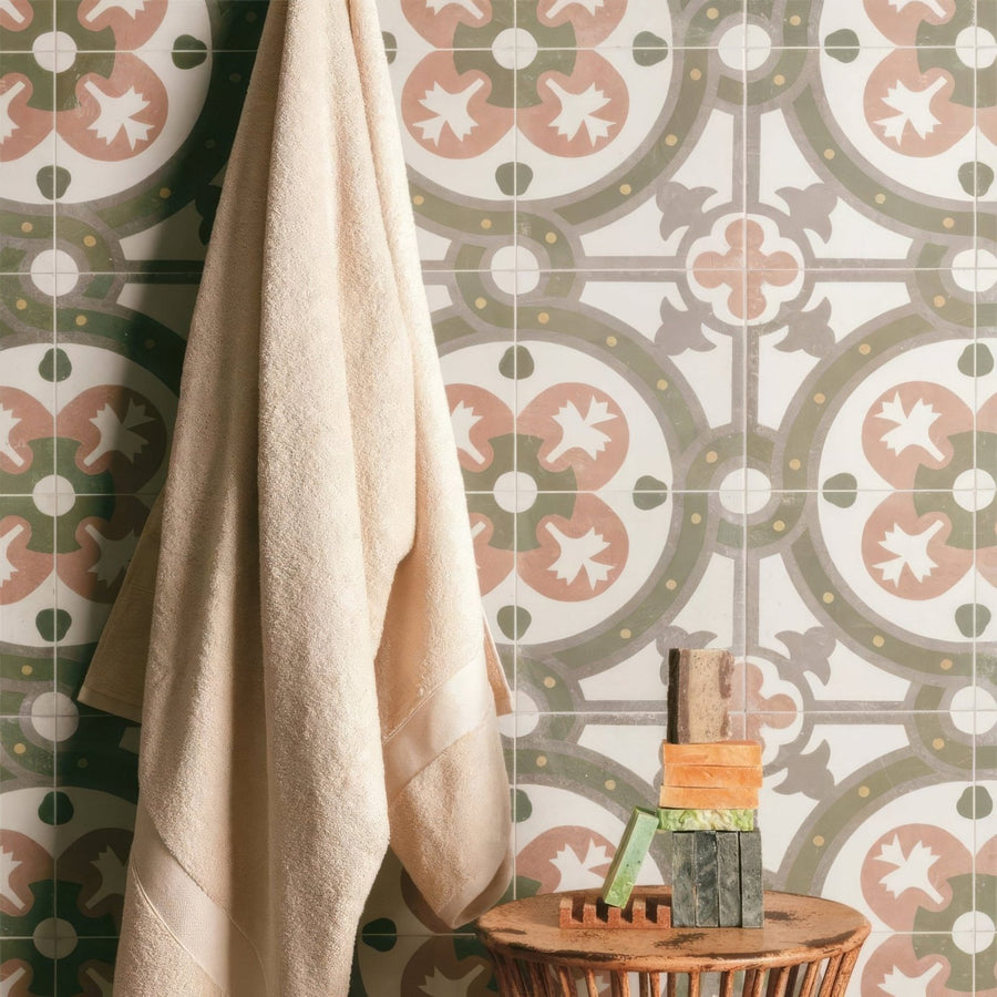 Beige textured towel hanging against zayda sage multi matt vitrified ceramic patterned tile wall 450x450mm