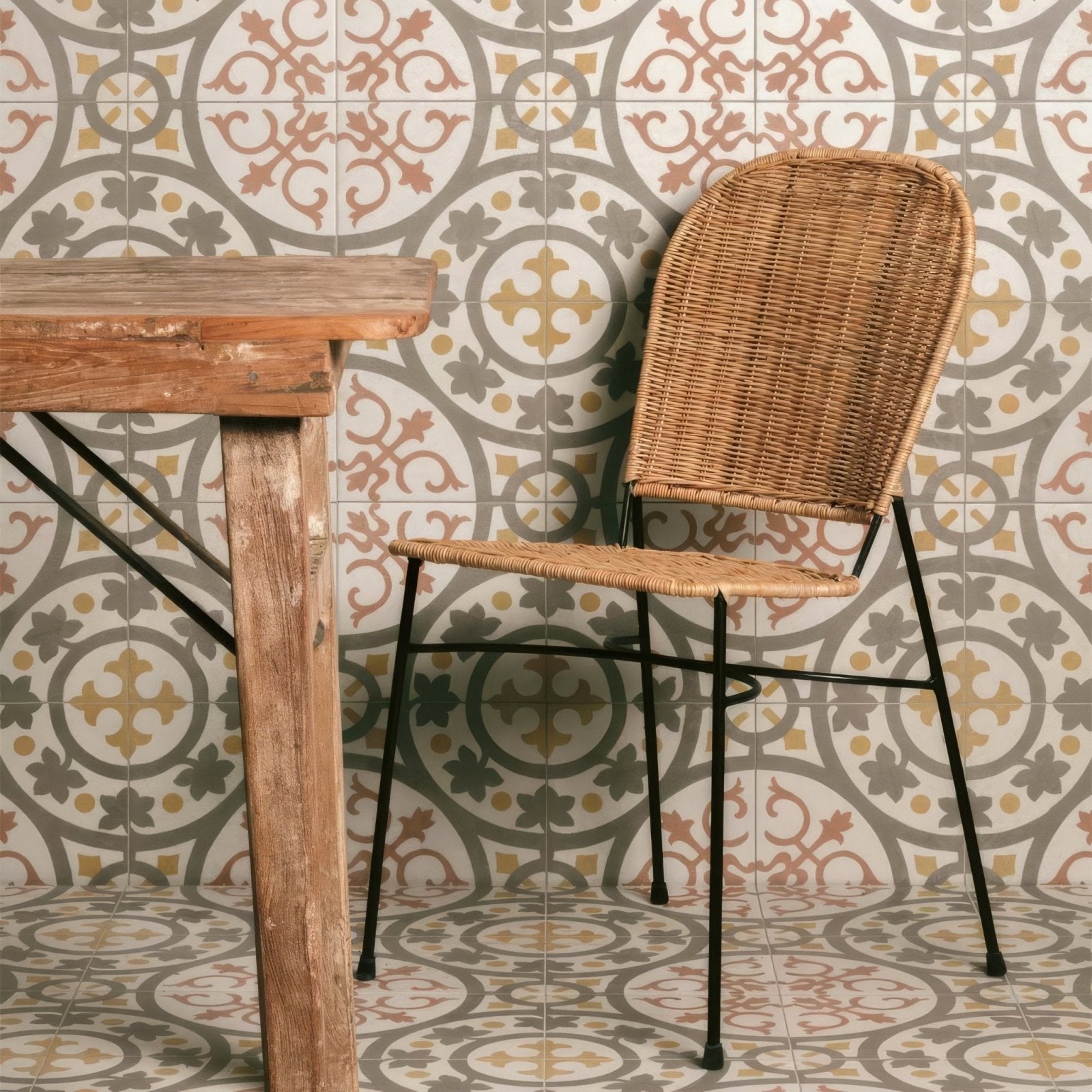 Woven wicker chair with black metal legs paired with zayda yellow multi matt vitrified ceramic tile 450x450mm