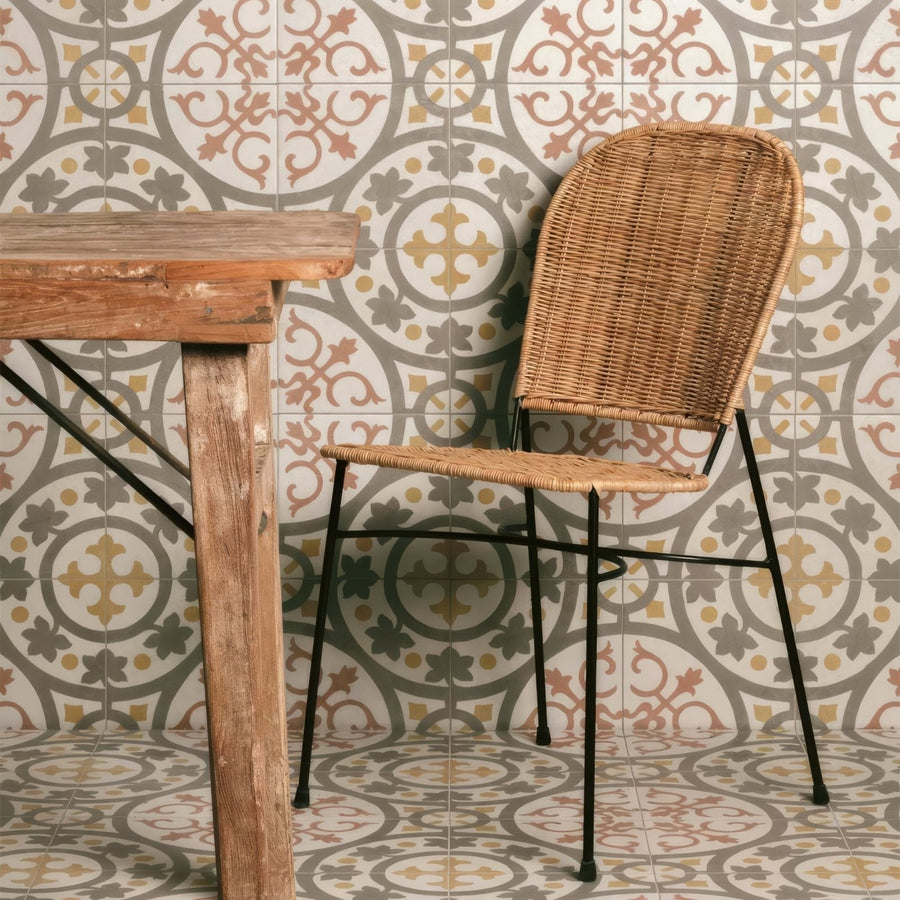 Woven wicker chair with black metal legs paired with zayda yellow multi matt vitrified ceramic tile 450x450mm