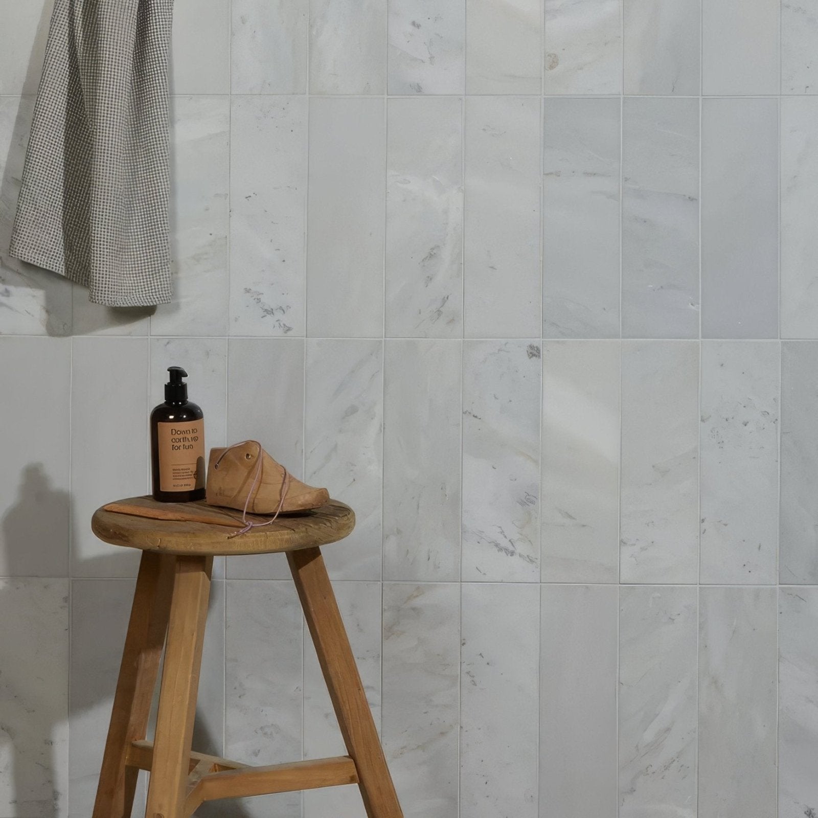 Zen Marble Honed Finish Brick white marble brick tiles with a leather shoe