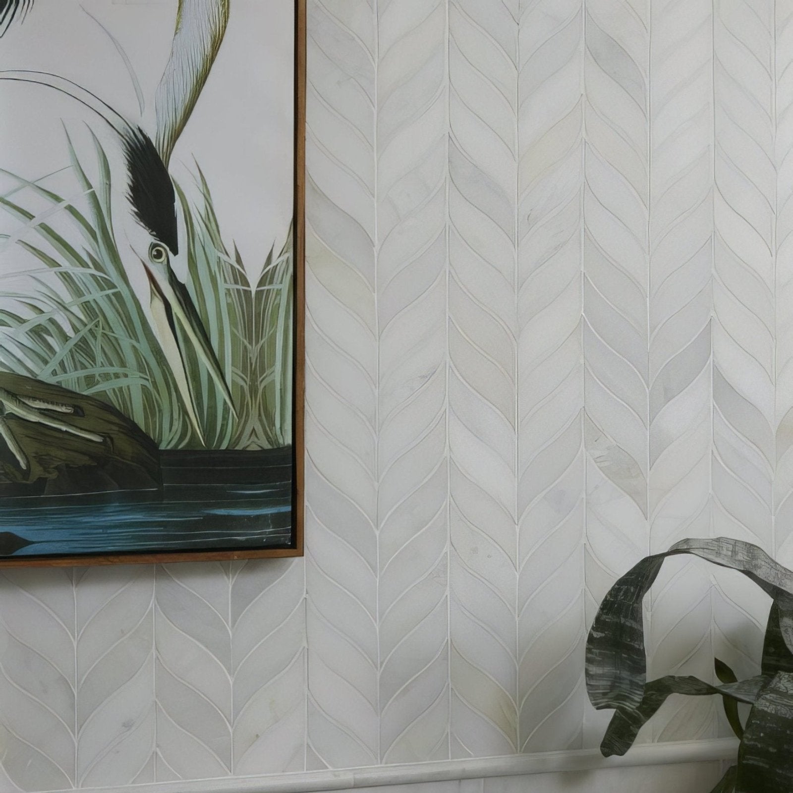 White marble tile with subtle veining arranged in a herringbone design for zen marble leaf mosaic pattern