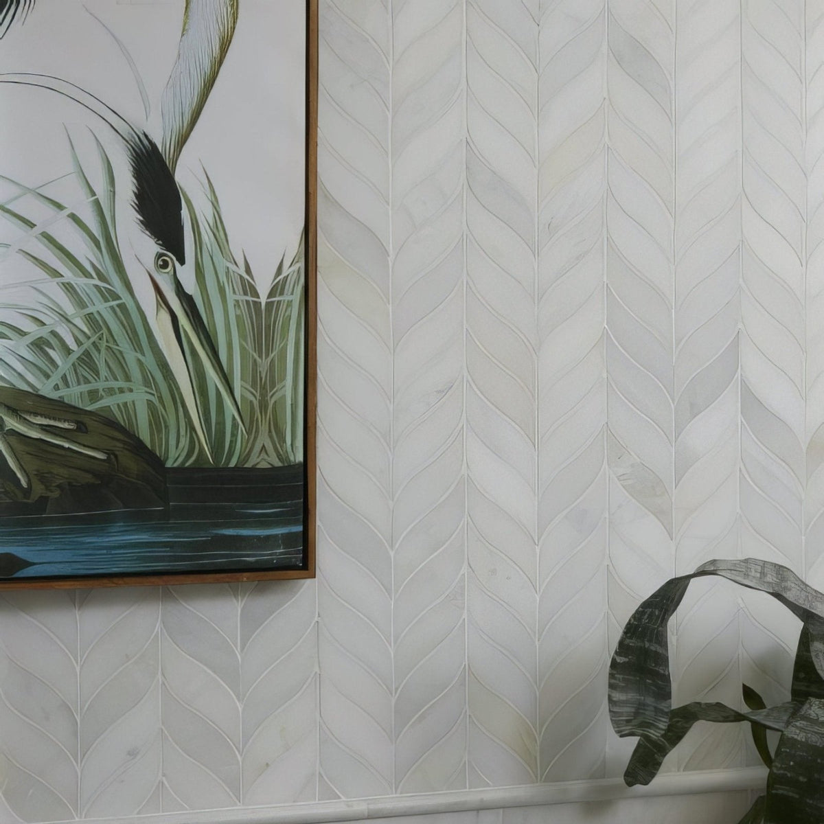 White marble tile with subtle veining arranged in a herringbone design for zen marble leaf mosaic pattern