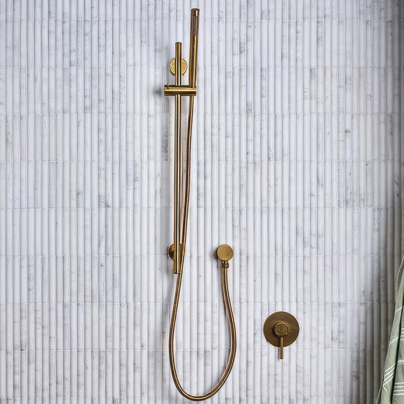 Modern gold-toned shower system with sleek brushed metal finish designed for zen marble reed mosaic bathroom decor