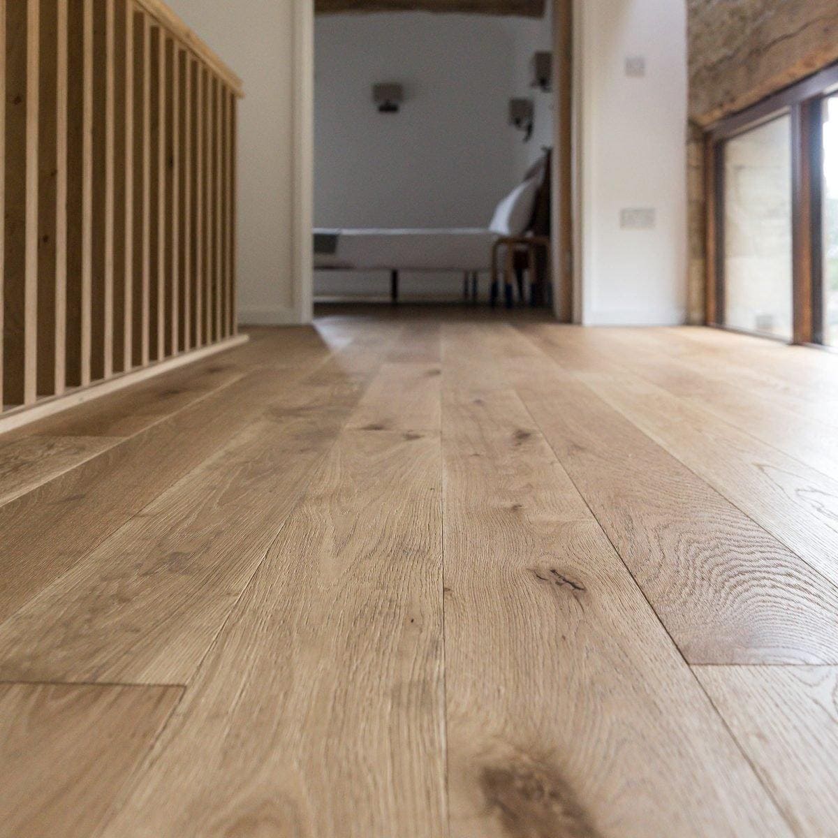 Light-colored alpine oak rustic brushed and oiled hardwood floor with natural wood grain finish