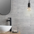 Atrium Marte Grafito Tiles grey concrete-effect tiles with a black matte tap
