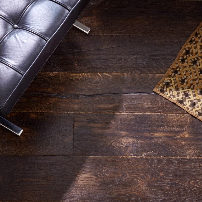 Dark brown berkeley charterhouse oak hardwood floor planks with rich textured grain and visible wood knots