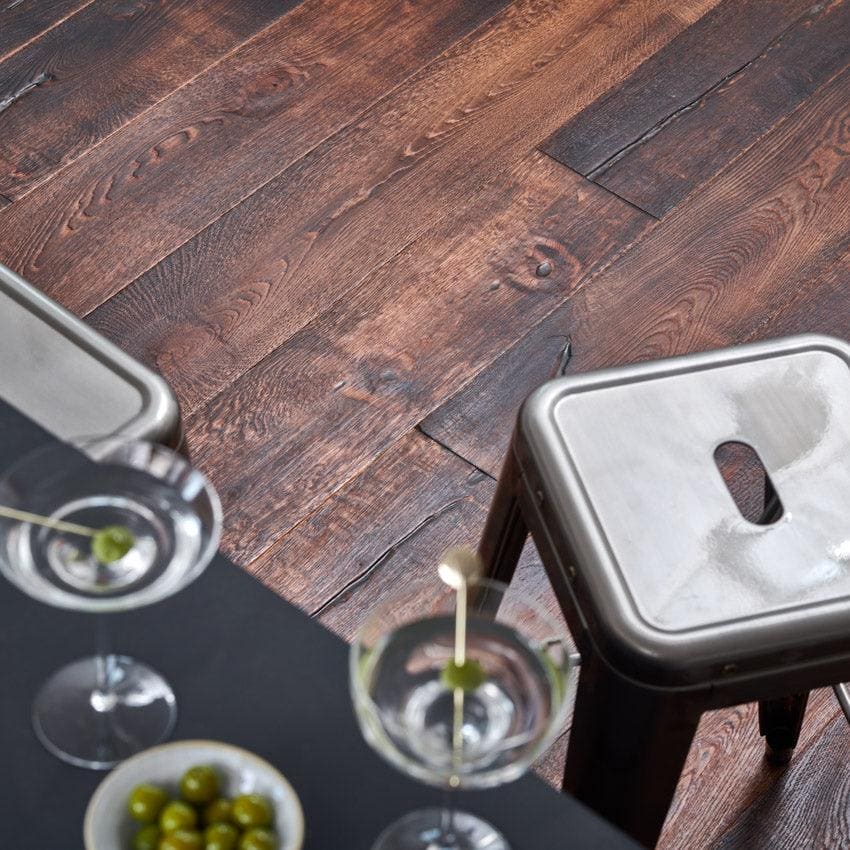Dark brown reclaimed oak wood plank flooring with visible grain and knots in berkeley priory oak style