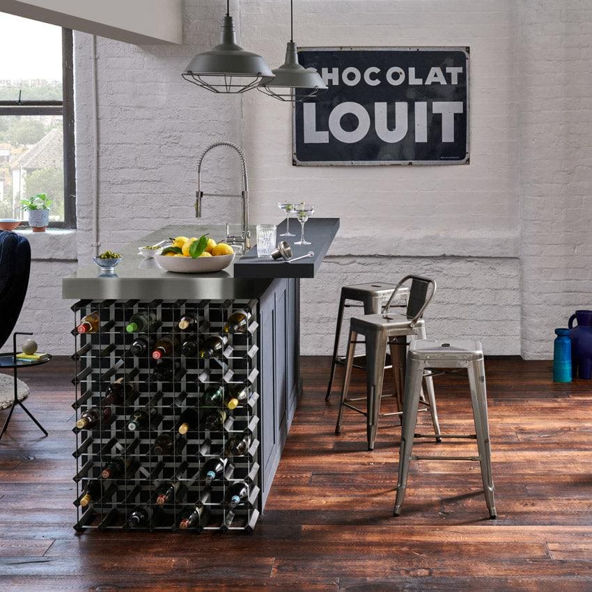 Black metal wine rack with geometric grid design integrated into the base of a berkeley priory oak kitchen island