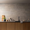 Berliner zement natural 200 x 1200mm gray textured concrete tiles with matte finish arranged as kitchen backsplash