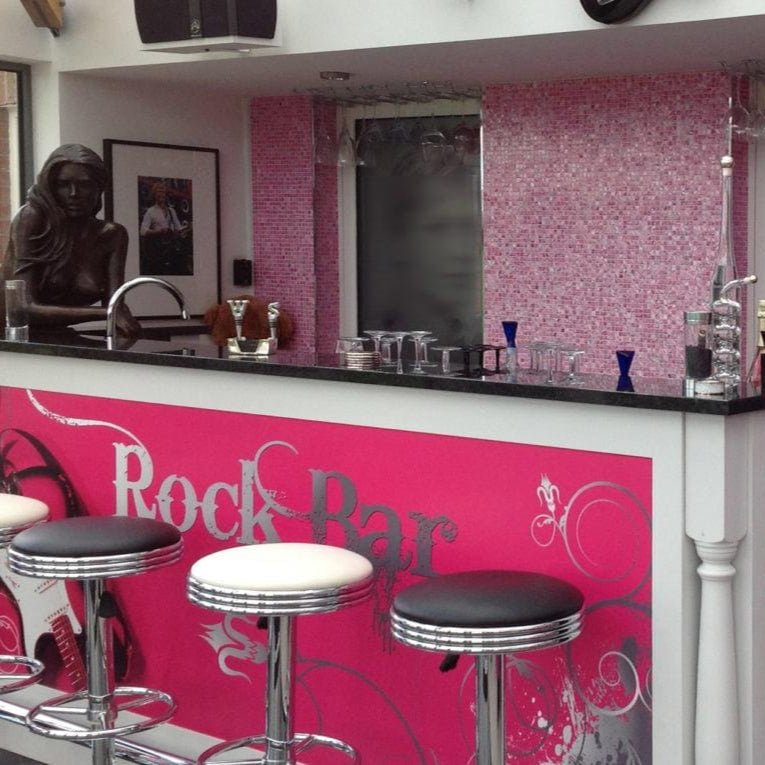 Pink and black retro-style blush 25mm square bar stools with chrome bases and cushioned seats for kitchen or bar use
