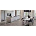 Modern white kitchen island with integrated stainless steel appliances and grey matt Boost 60 x 60cm tiles