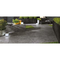 Dark gray stone patio tiles with textured natural finish 20mm from bravestone outdoor collection