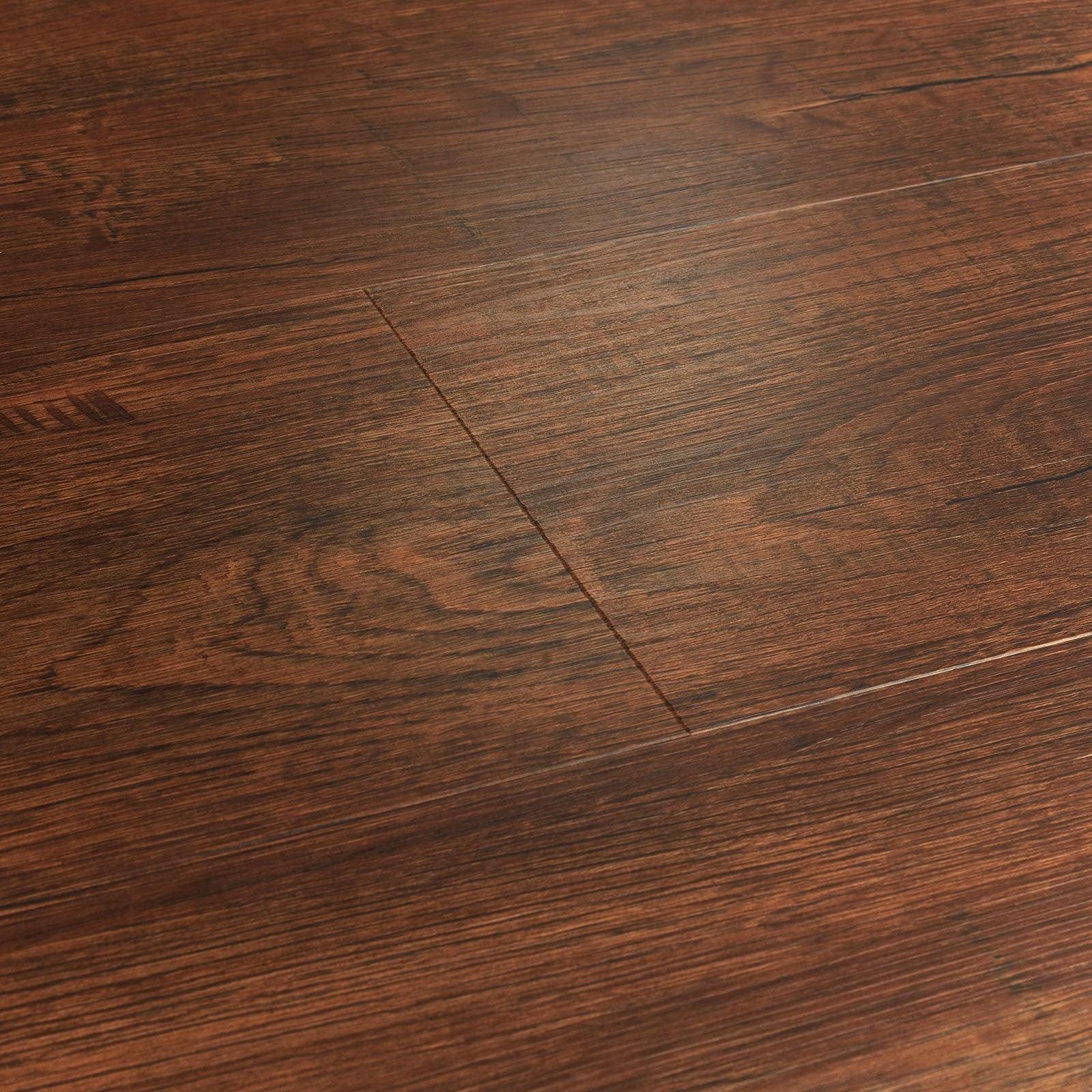 Rich dark brown brecon heritage oak hardwood flooring with natural wood grain pattern and visible plank seams