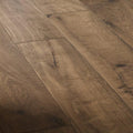 Dark brown canaiolo castagno hardwood floor planks with natural wood grain and subtle knots