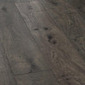 Dark gray canaiolo quercia hardwood floor planks with natural wood grain pattern and visible knots