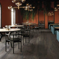 Dark gray canaiolo quercia wood-look flooring with subtle grain pattern ideal for modern interiors