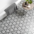 Black and white patterned bathroom floor tiles with a floral geometric design carnaby hexagon black