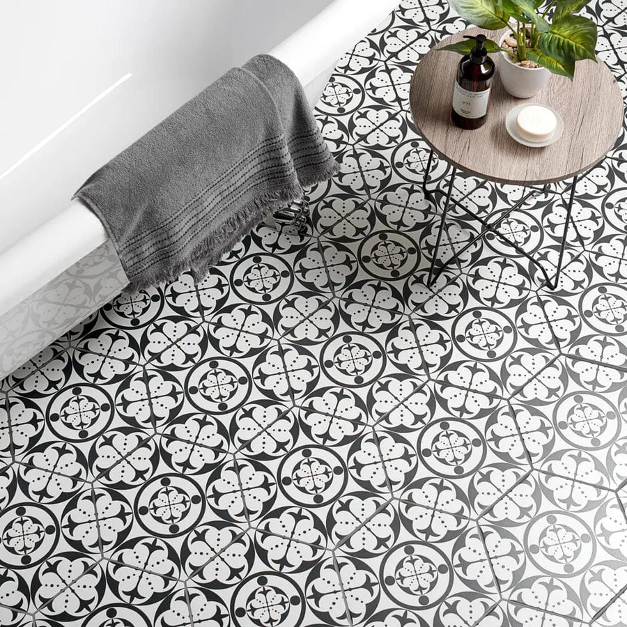Black and white patterned bathroom floor tiles with a floral geometric design carnaby hexagon black
