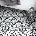 Carnaby hexagon black bathroom floor tiles featuring black and white ornate repeating floral pattern design