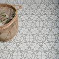 Hexagonal floor tiles with a repeating gray and white floral pattern from the carnaby hexagon grey collection