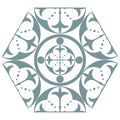 A carnaby hexagon sky ceramic tile with a symmetrical ornate pattern in muted teal and white