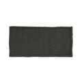A sleek matte black rectangular ceramic clay smoke glazed wall tile 65x130mm with textured uneven edges