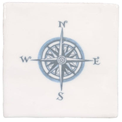 White ceramic coaster with detailed blue compass rose design and cardinal directions in compass blue on cotton style