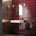 White rectangular wall-mounted sink with black faucet and chrome fixtures in damask distressed rose gold style