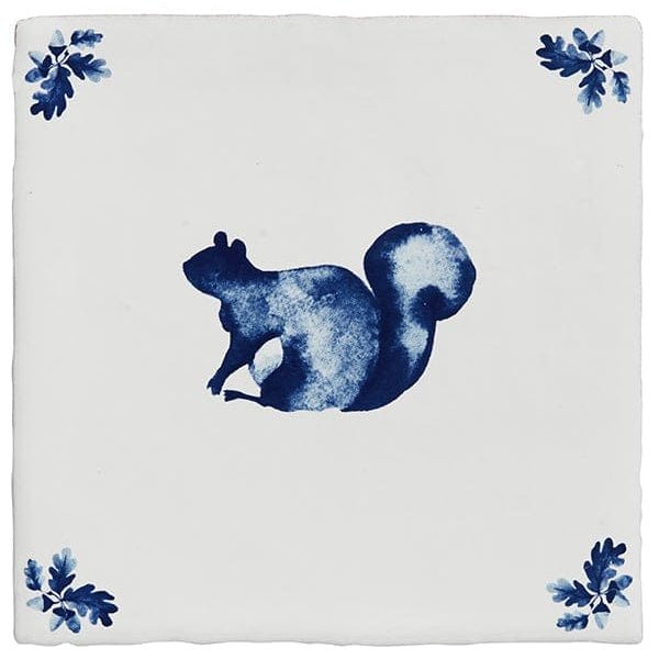 Blue squirrel illustration on white ceramic tile with leaf motifs in each corner from dyrham dairy ceramic decors