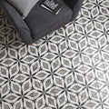 Black and white marble patterned elazig hexagon floor tiles with repeating geometric leaf design