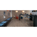 Light brown wood-look floor tiles etic rovere grigio matt with subtle grain pattern and matte finish