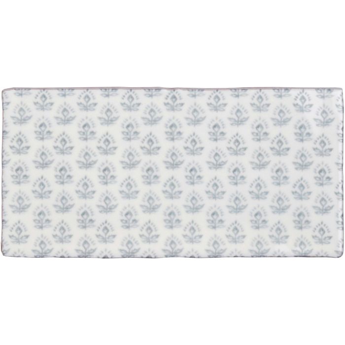 A rectangular white Fabrique Picot French Blue mat with a repeating pattern of light gray floral motifs