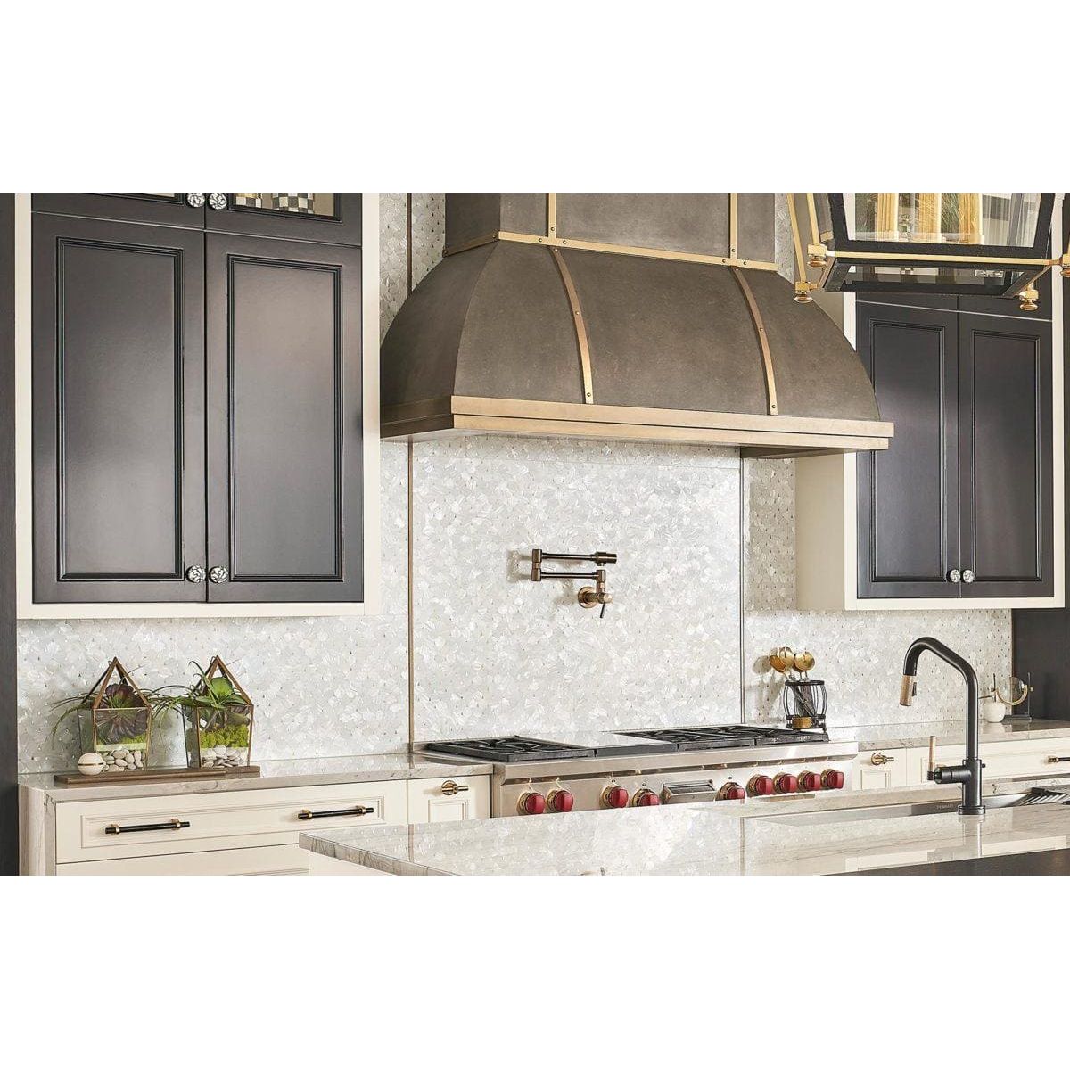 Feature Panel Pearl Drop pearlescent shell mosaic panel with a bronze and brass range hood