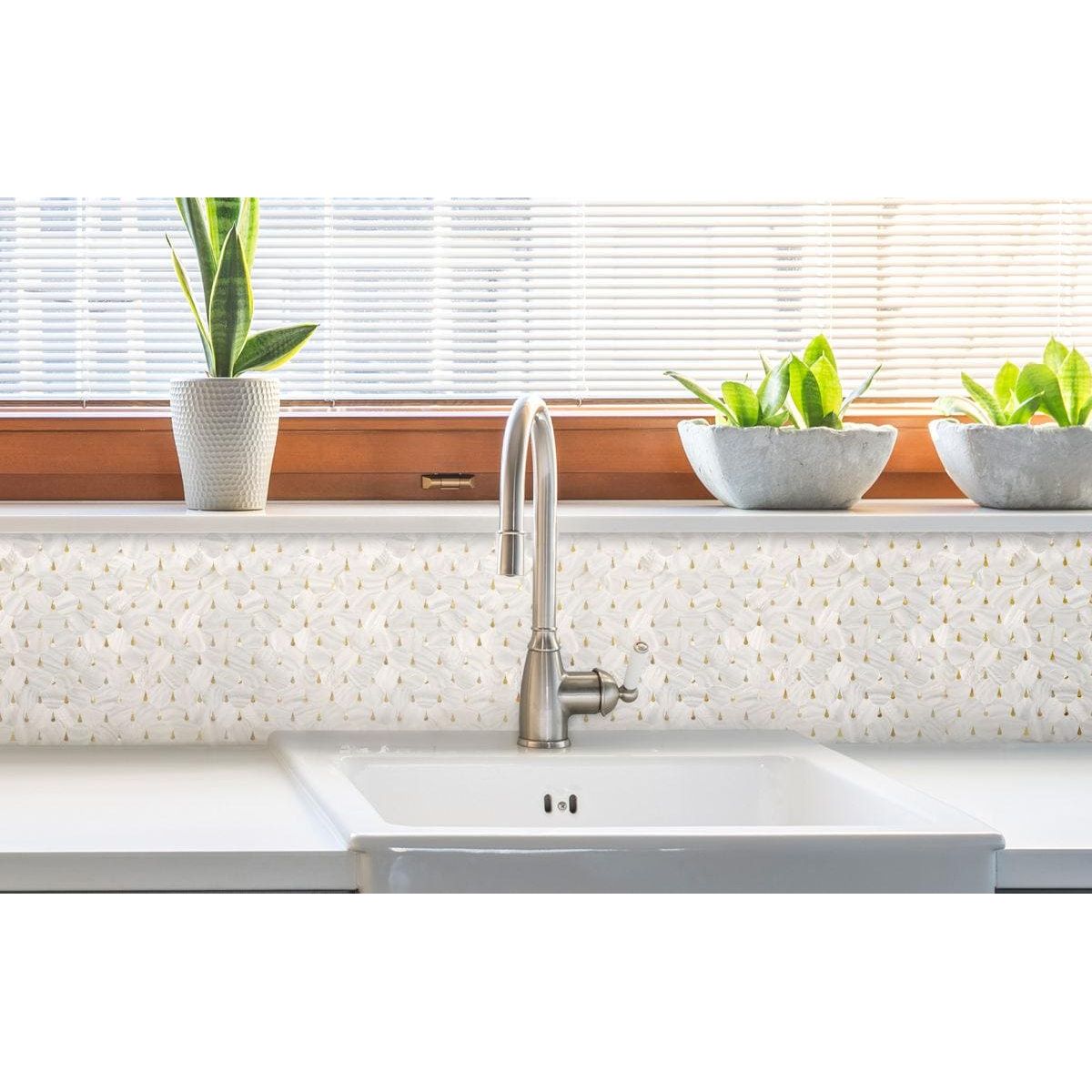 Feature Panel Pearl Drop pearlescent shell mosaic panel with a stainless steel kitchen tap