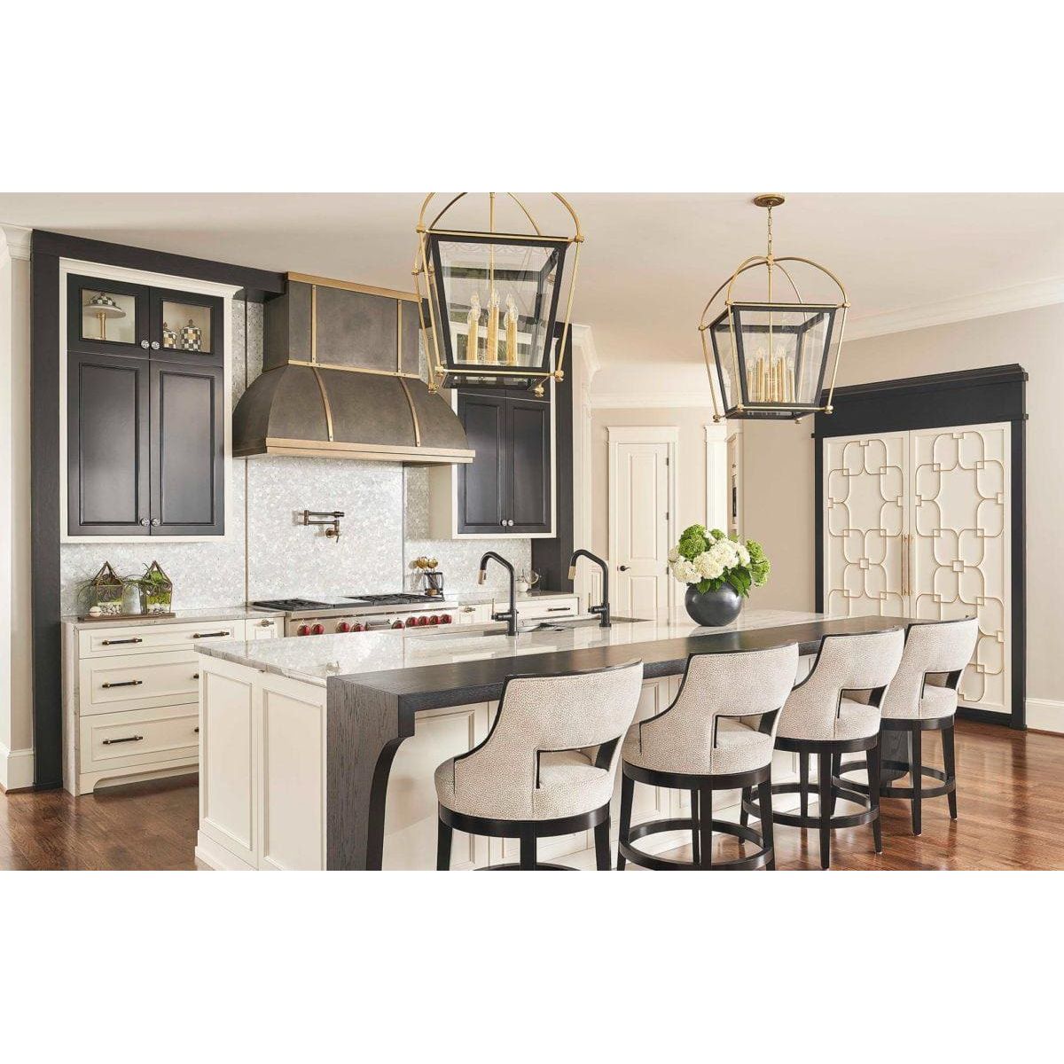 Feature Panel Pearl Drop pearlescent shell mosaic panel with a black and white kitchen island and bar stools