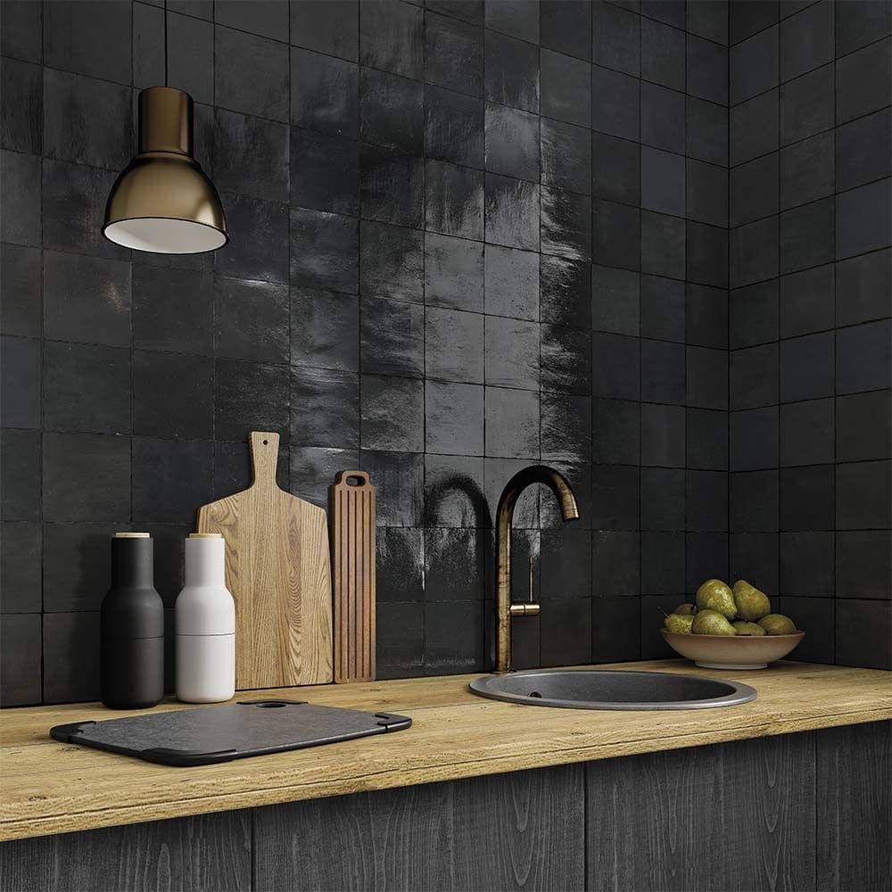 Dark glossy ceramic wall tiles with a matte black finish and subtle sheen used as kitchen backsplash 130x130mm