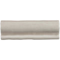 Beige ceramic flint torus moulding tile with smooth glossy finish and subtle wavy edges for decorative edging
