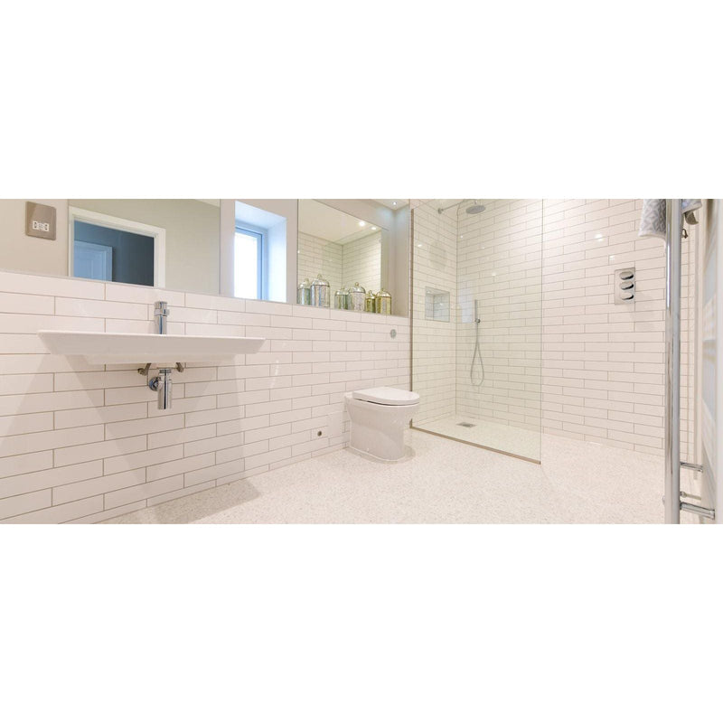 Gemstones Terrazzo White Matt 60 x 60cm white terrazzo tiles in a shower enclosure with chrome fixtures