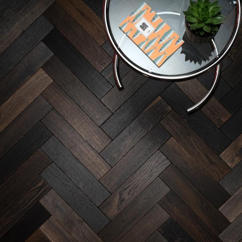 Dark wood Goodrich charred oak planks arranged in a herringbone pattern for flooring or wall design