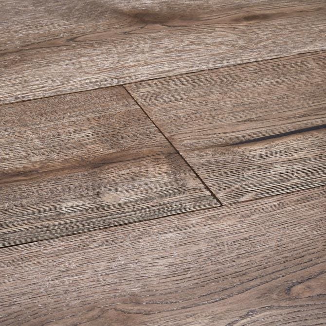 Harlech biscotti oak grayish brown wood plank flooring with realistic grain pattern and subtle texture